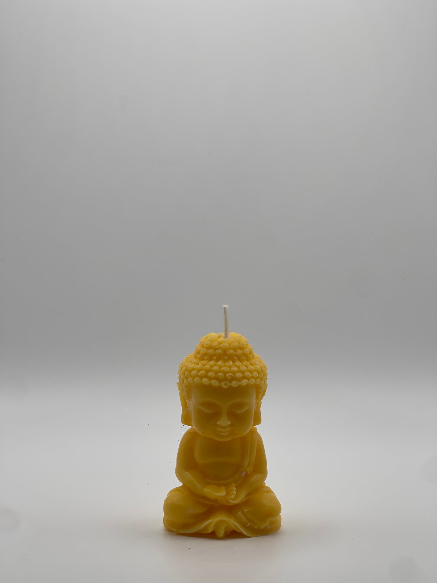 Vela "Buda Meditando" Amarillo